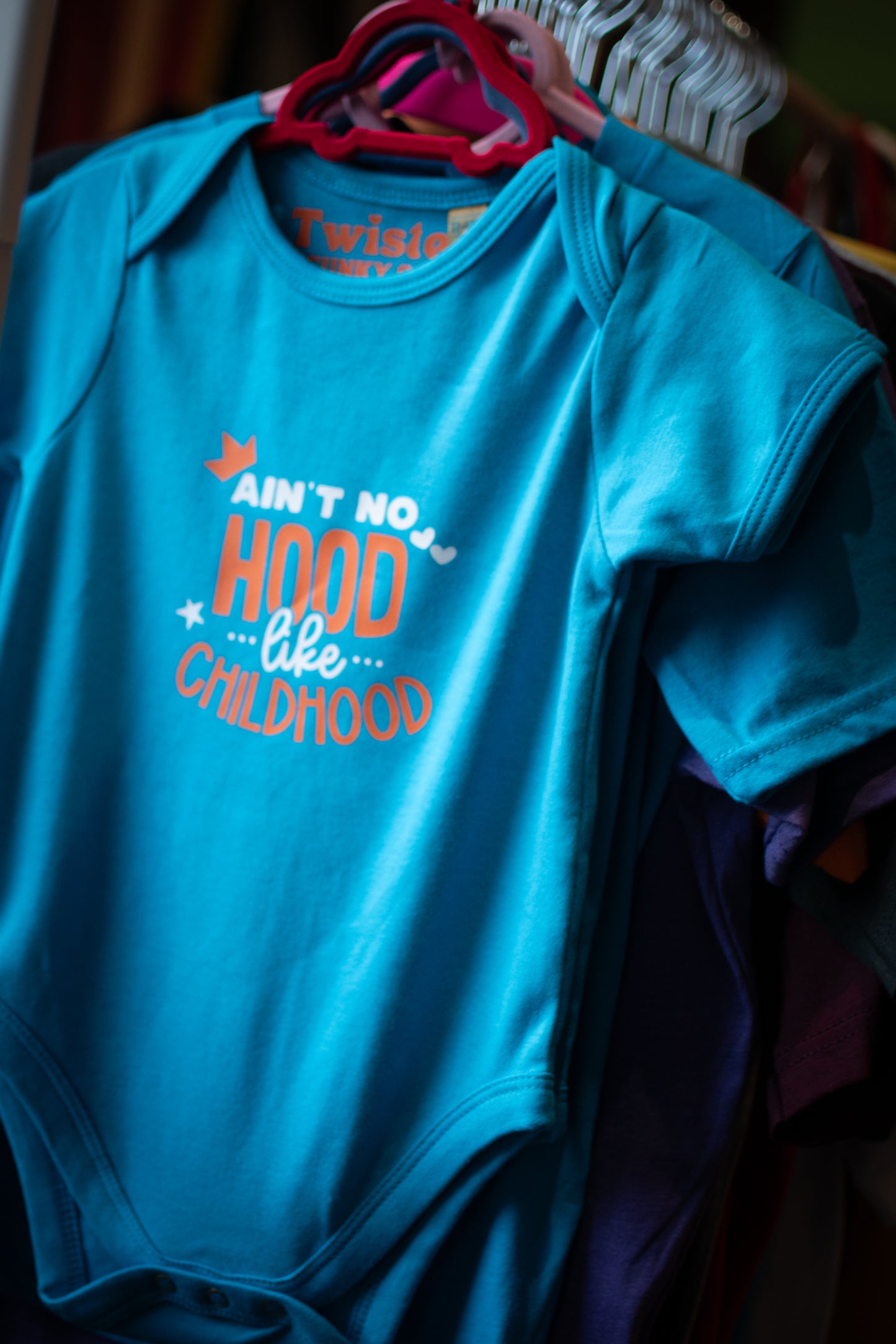 Ain't No Hood Like Childhood Baby Bodysuit