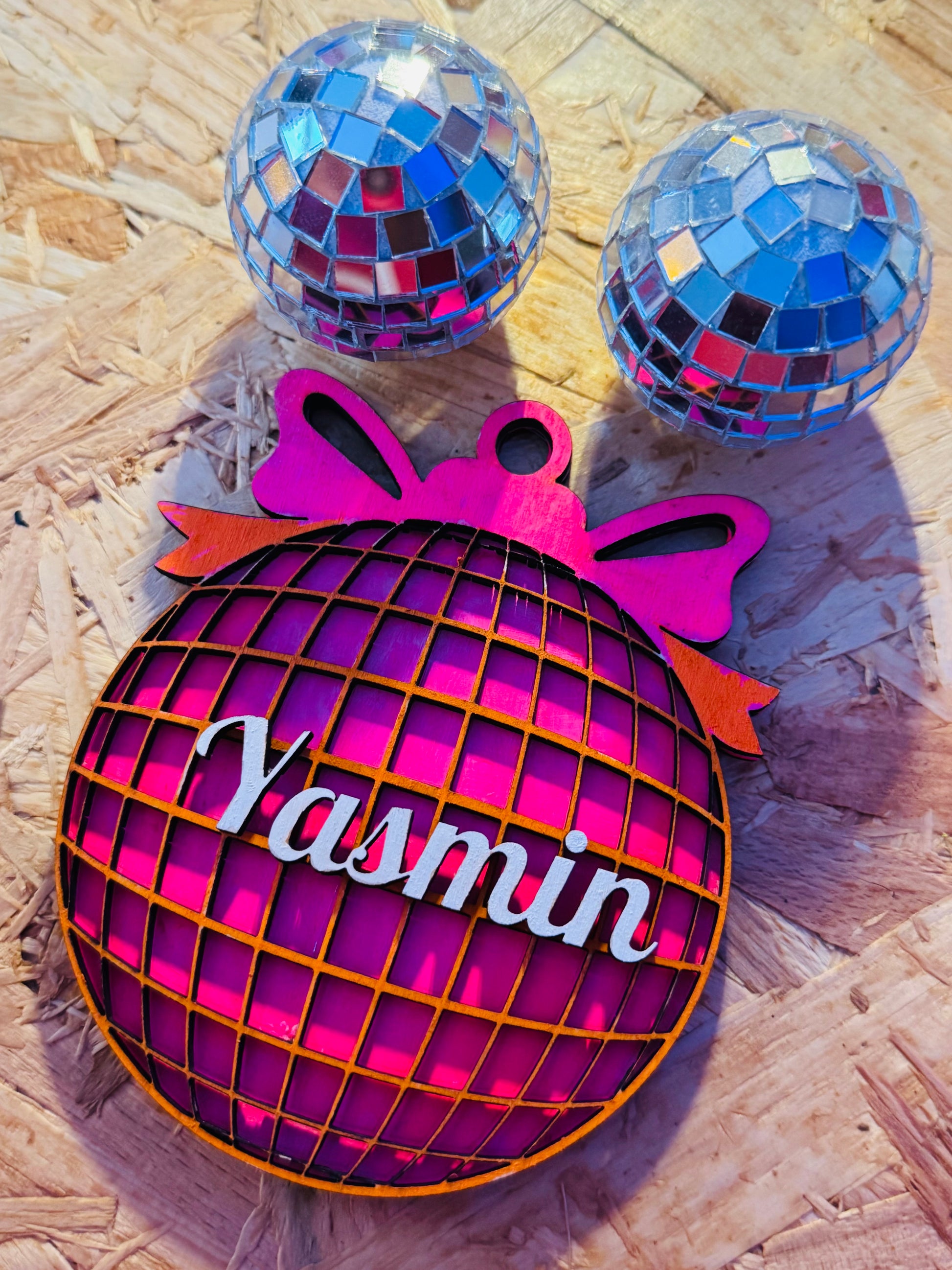 Layered neon pink and orange disco ball bauble personalised with name