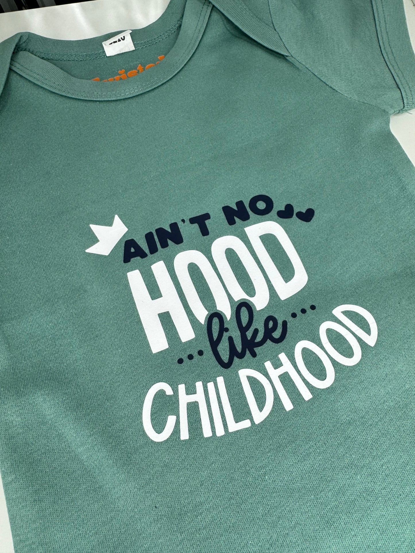Ain't No Hood Like Childhood Baby Bodysuit